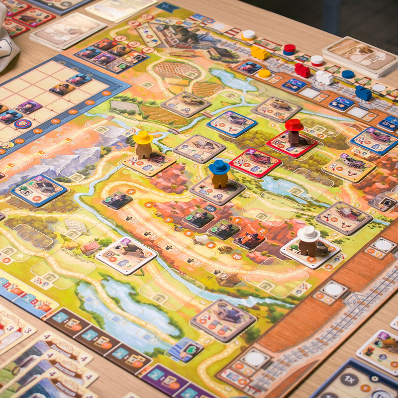 Load image into Gallery viewer, Great Western Trail Board Game - view of setup game including game board, cards, meeples, and game tiles.