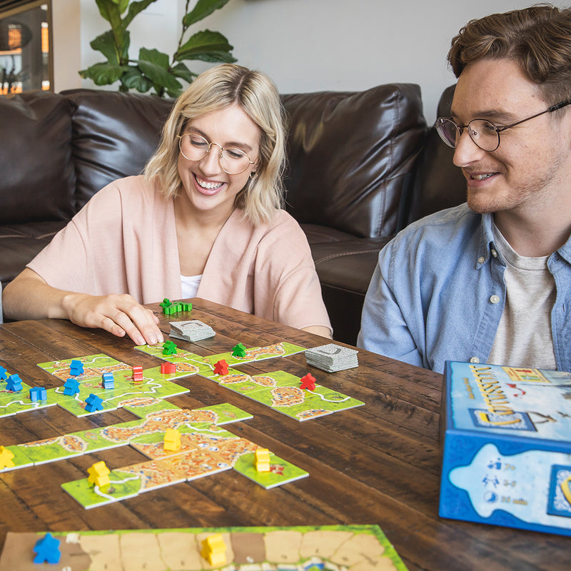 Load image into Gallery viewer, Carcassonne Board Game lifestyle image of two people playing the game.