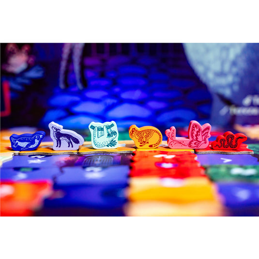 Night at the Zoo Board Game - Animal meeples shown including wolf, sloth, butterfly, and snake meeples.