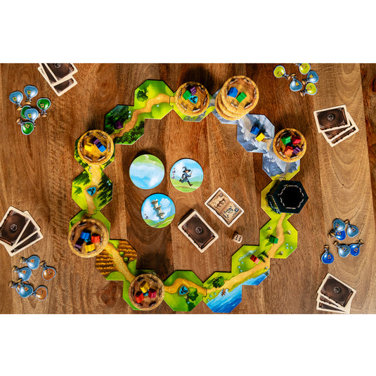 Wandering Towers Board Game - setup game shown on top of coffee table including map tiles, tower figures, game cards, and potion tokens. 