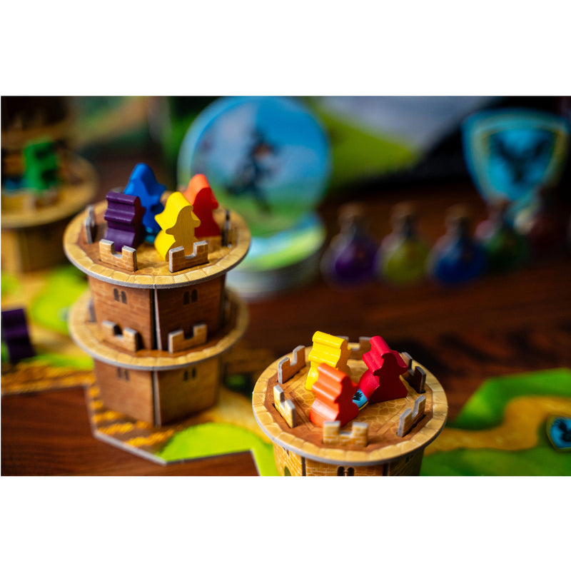 Load image into Gallery viewer, Wandering Towers Board Game - sample components shown including tower figures with meeples in different colors on top.
