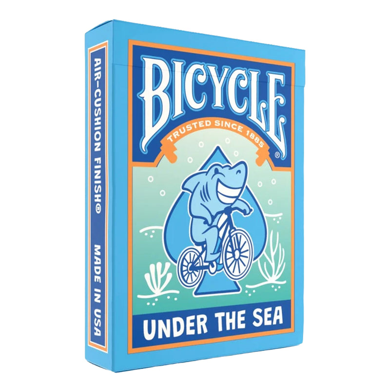Load image into Gallery viewer, Bicycle Under the Sea Playing Cards - front of packaging featuring art of a shark riding a bicycle. 
