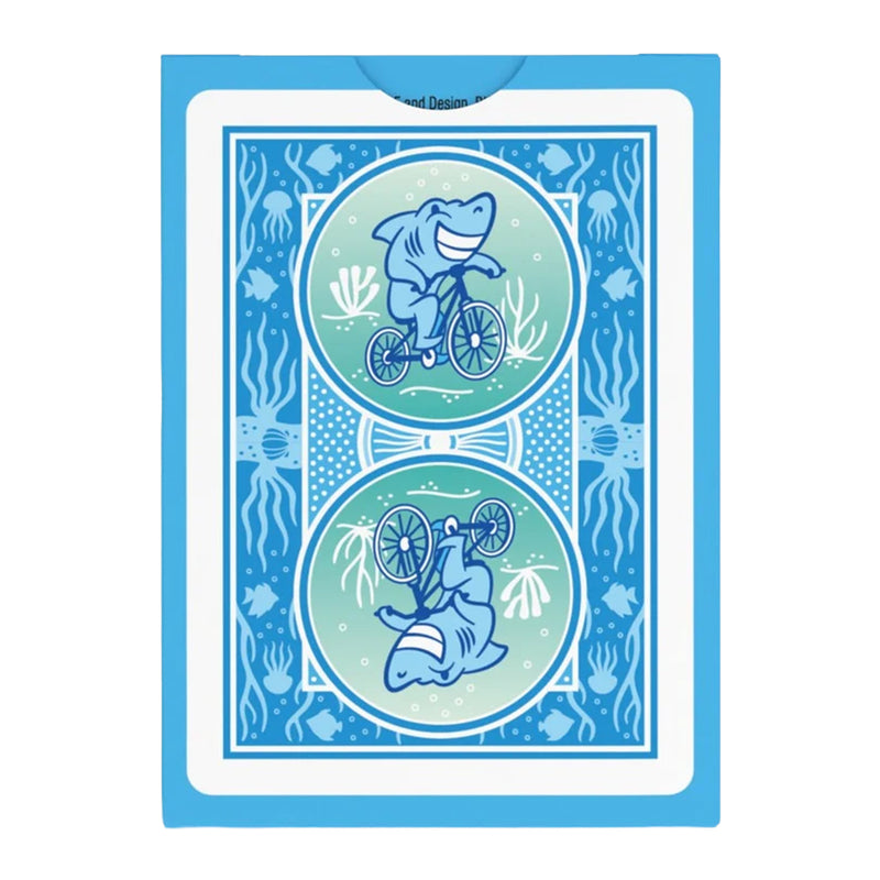Load image into Gallery viewer, Bicycle Under the Sea Playing Cards - back of packaging featuring art of a shark riding a bicycle. 
