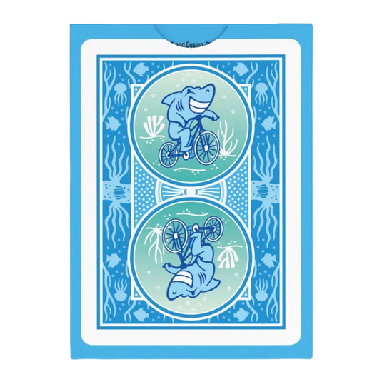 Bicycle Under the Sea Playing Cards - back of packaging featuring art of a shark riding a bicycle. 