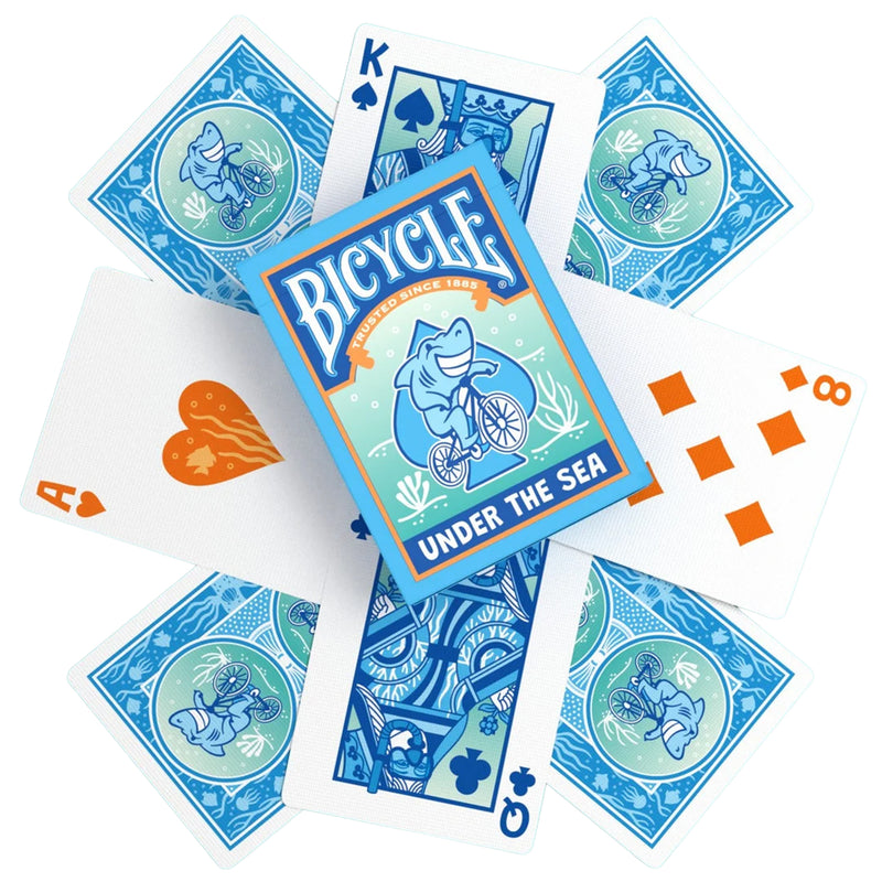 Load image into Gallery viewer, Bicycle Under the Sea Playing Cards - box and sample cards shown with king and queen cards illustrated wearing scuba masks. 
