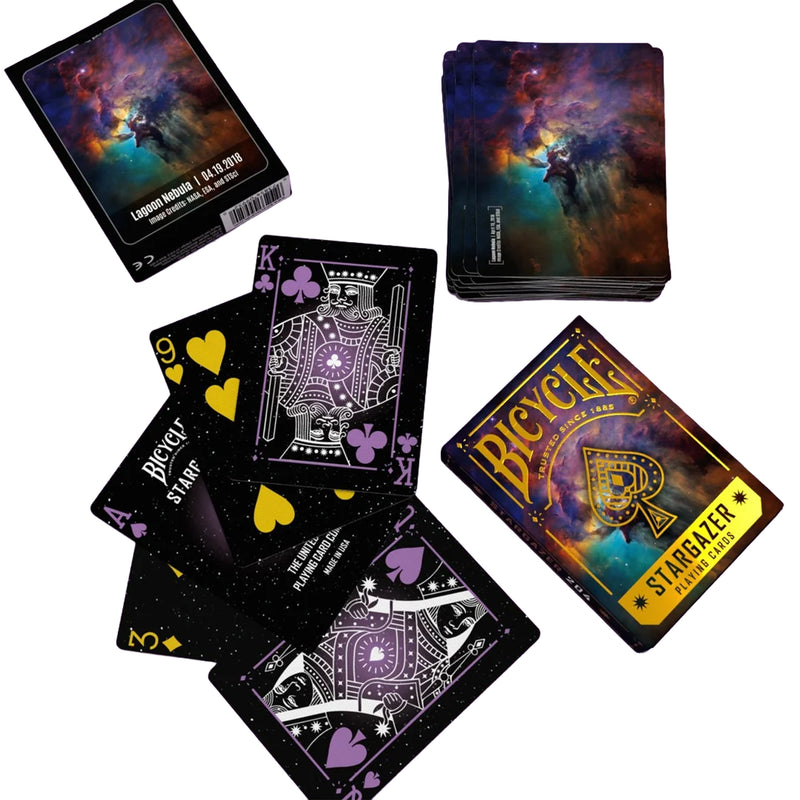 Load image into Gallery viewer, Bicycle Stargazer 204 Playing Cards - view of box and sample cards. Backs of cards feature Lagoon Nebula imagery from Hubble Telescope. Front of cards has space themed art design.
