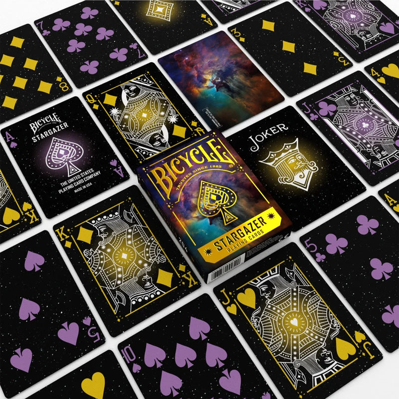 Load image into Gallery viewer, Bicycle Stargazer 204 Playing Cards - view of box and sample cards. Each card has a space themed background. 
