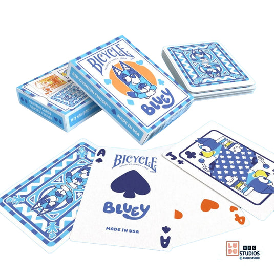Bicycle Bluey Playing Cards - view of box and sample cards. Card backs and face cards feature art of Bluey characters.