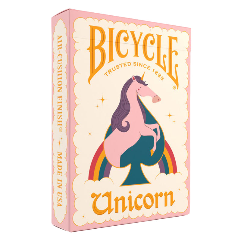 Load image into Gallery viewer, Bicycle Unicorn Pink Playing Cards - Front of packaging featuring illustration of a pink unicorn and a rainbow. 
