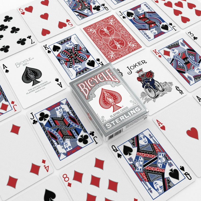 Load image into Gallery viewer, Bicycle Sterling Playing Cards Red/Blue Mix - Packaging and cards displayed with red card backs. 
