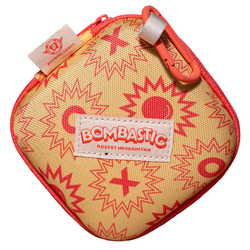 Load image into Gallery viewer, Bombastic Board Game - view of front of zip-up clamshell case with orange carabiner. 
