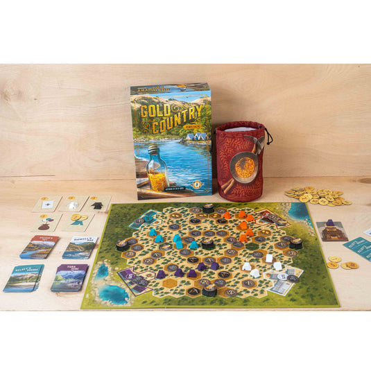 Gold Country Board Game - Bx and game components shown including draw bag, game board with hex map, meeples in a variety of colors, and coin tokens. 