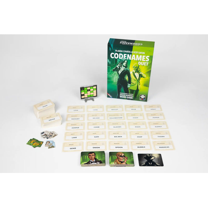 Load image into Gallery viewer, Codenames: Duet Party Game - box and setup game shown including word cards, agents map card, and agent tiles. 
