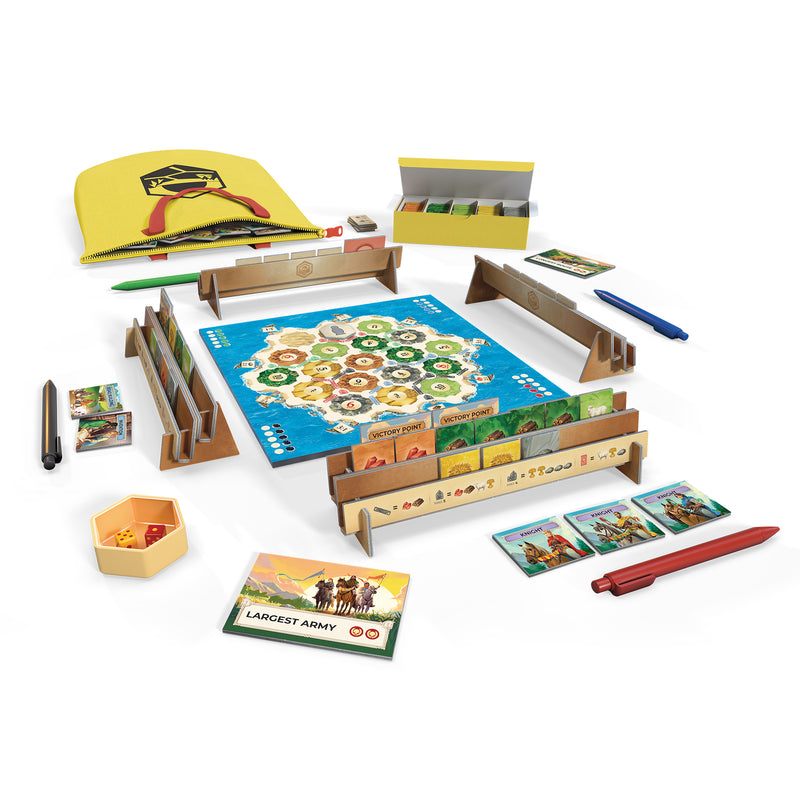 Load image into Gallery viewer, CATAN – Zip! Board Game - setup game shown including CATAN map pad, storage boxes, travel bag, and pens. 
