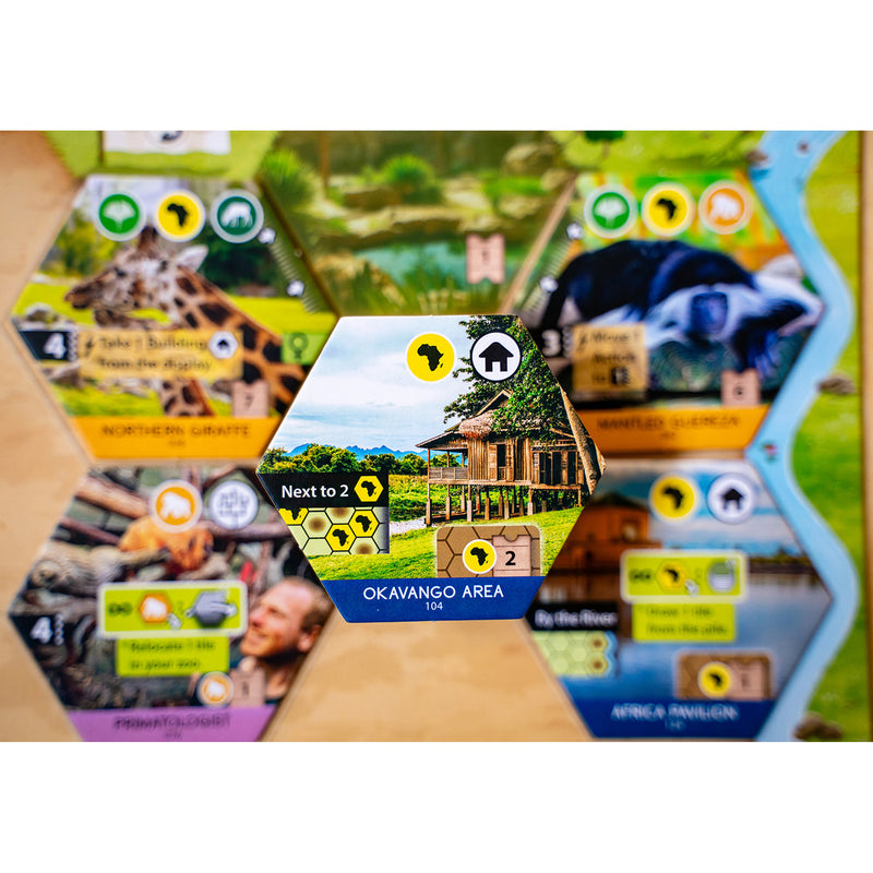 Load image into Gallery viewer, Sanctuary Board Game - view of sample Okavango Area tile with a continent icon and house icon. 

