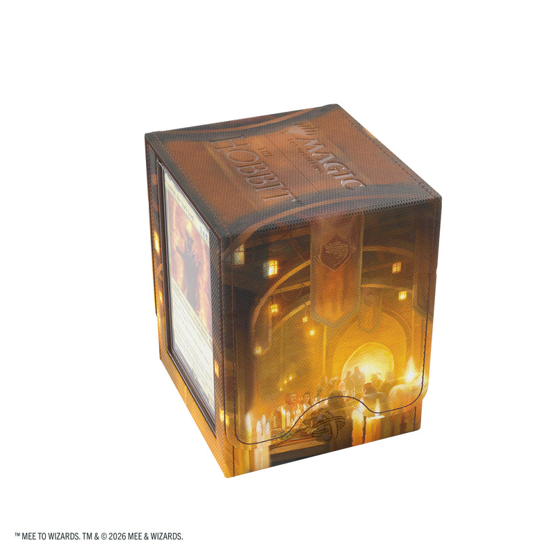 Load image into Gallery viewer, Magic: The Gathering | The Hobbit Squire PLUS 100+ XL - The Queen of Dale - View of side of deck box featuring art of a feast in a castle hall and with Magic the Gathering and The Hobbit branding on the lid. 
