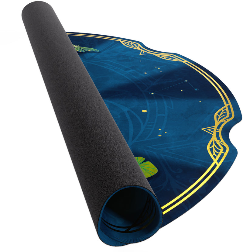 Load image into Gallery viewer, Take Time Premium Game Mat - view of partially rolled up game mat with blue circular design. 
