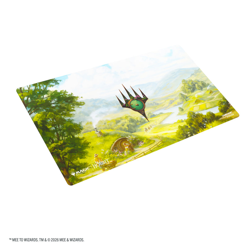 Load image into Gallery viewer, Magic: The Gathering | The Hobbit Prime Playmat - The Shire - View of playmat featuring art of The Shire and the Magic the Gathering logo. 
