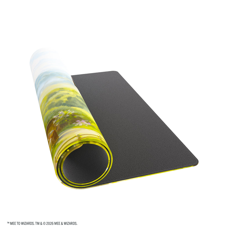 Load image into Gallery viewer, Magic: The Gathering | The Hobbit Prime Playmat - The Shire - View of partially rolled up playmat. 
