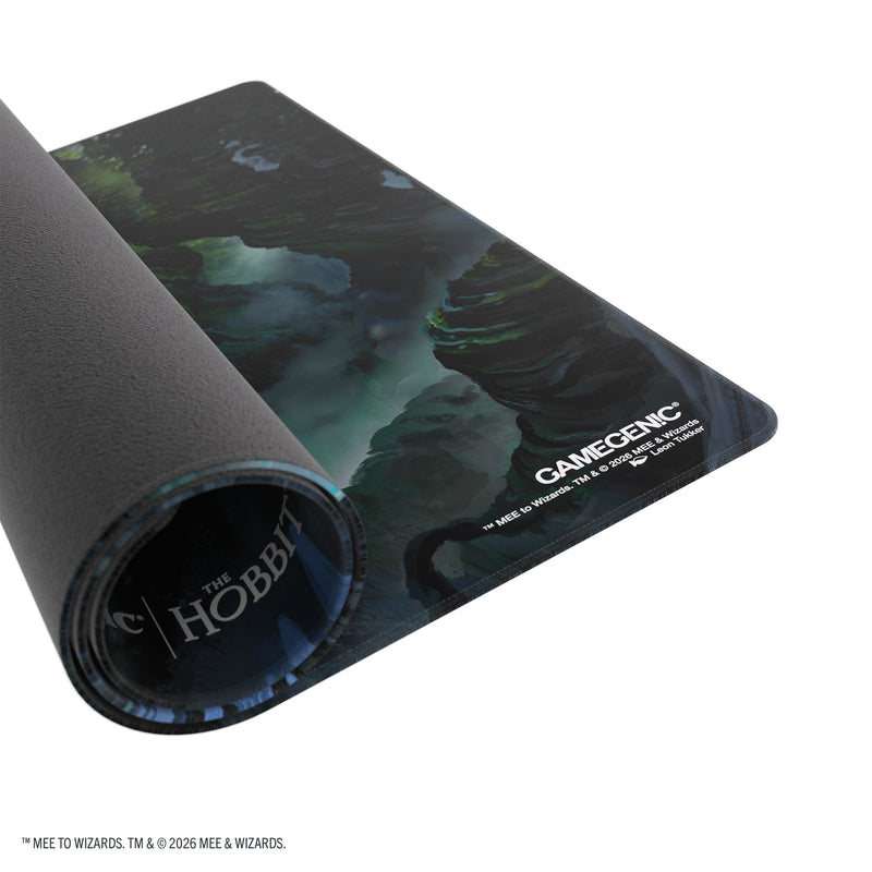 Load image into Gallery viewer, Magic: The Gathering | The Hobbit Shiny Playmat - Mirkwood - View of partially rolled up playmat. 
