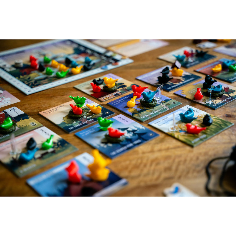 Load image into Gallery viewer, Perch Board Game - view of bird figures in different colors on top of game tiles. 
