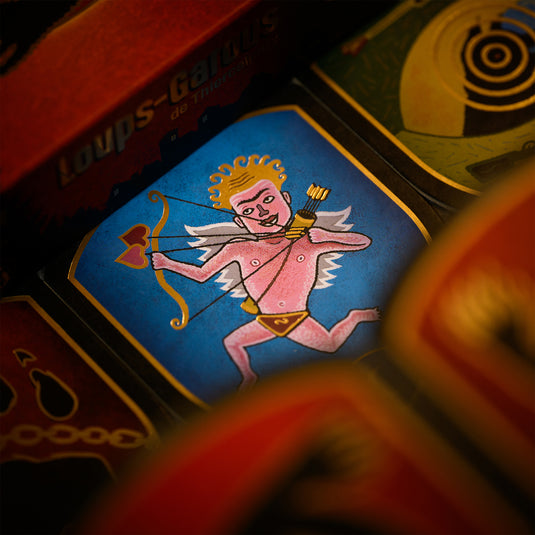Werewolves of Miller Hollow Limited Edition 25 Years - Token displayed featuring illustration of cupid shooting his bow. 