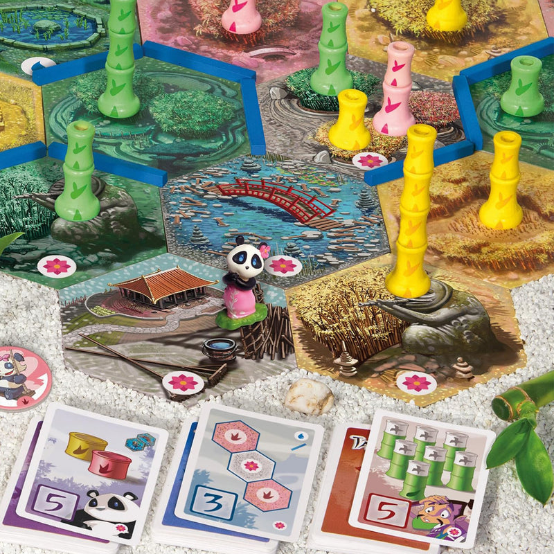 Load image into Gallery viewer, Takenoko Chibis Eco - Game components shown including panda miniature, game cards, map tiles, and bamboo figures. 
