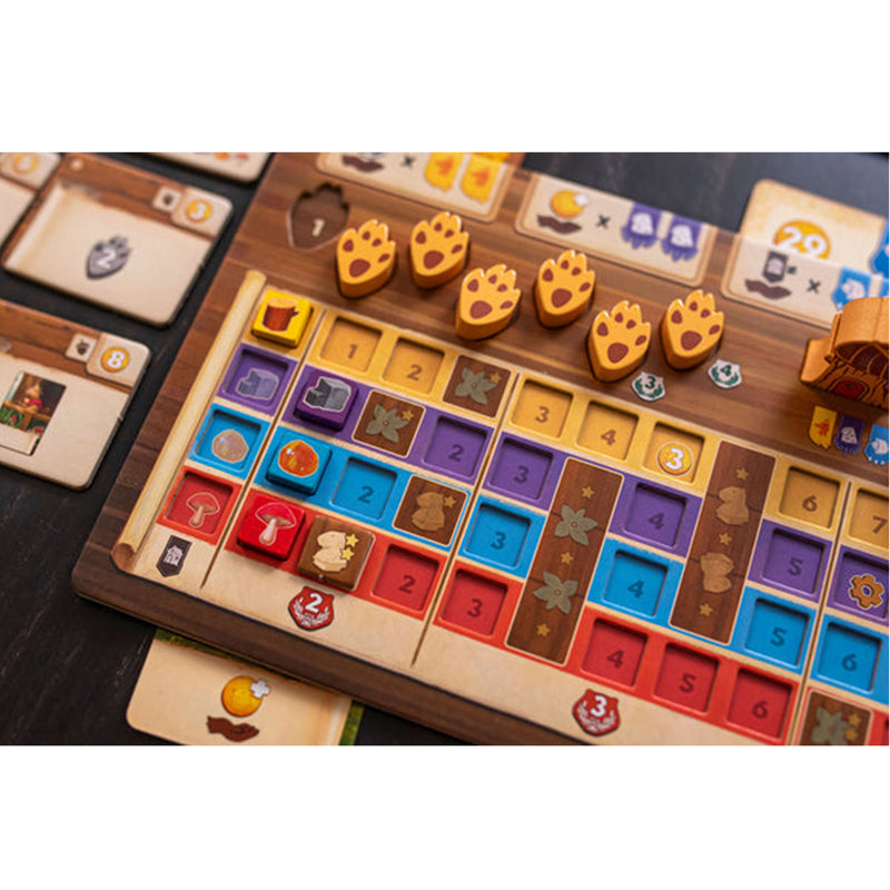 Load image into Gallery viewer, Kingdom Crossing Board Game - Player board shown with orange paw print tokens and resource tokens. 
