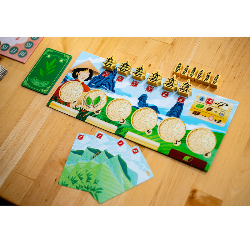 Load image into Gallery viewer, Tea Garden Board Game - sample components shown including player board, hand of cards, and yellow meeples. 
