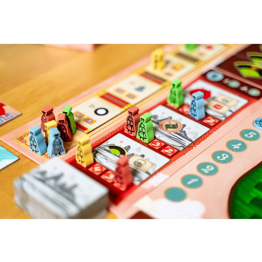 Tea Garden: Puerh Expansion - sample components shown including meeples and tokens shown on top of game board.