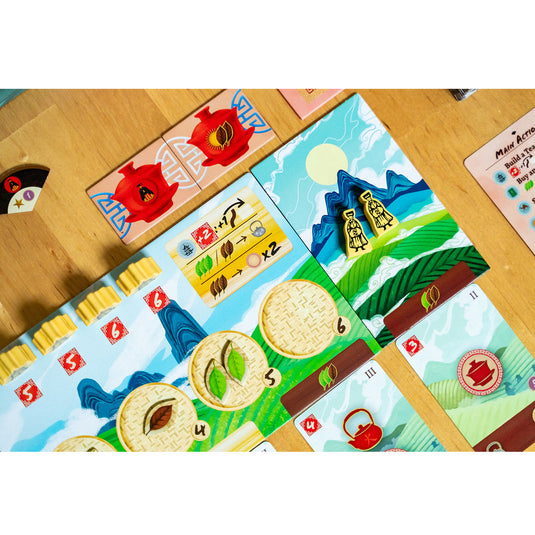 Tea Garden: Puerh Expansion - sample components shown including meeples and tokens shown on top of game board.