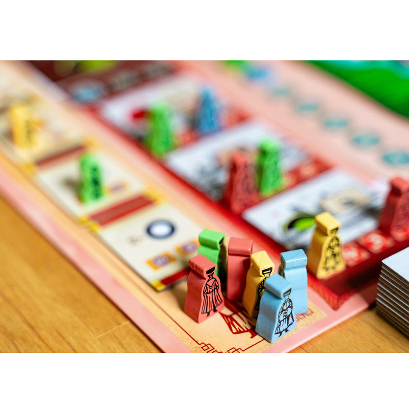 Load image into Gallery viewer, Tea Garden: Puerh Expansion - sample meeples shown in red, green, yellow, and blue. 
